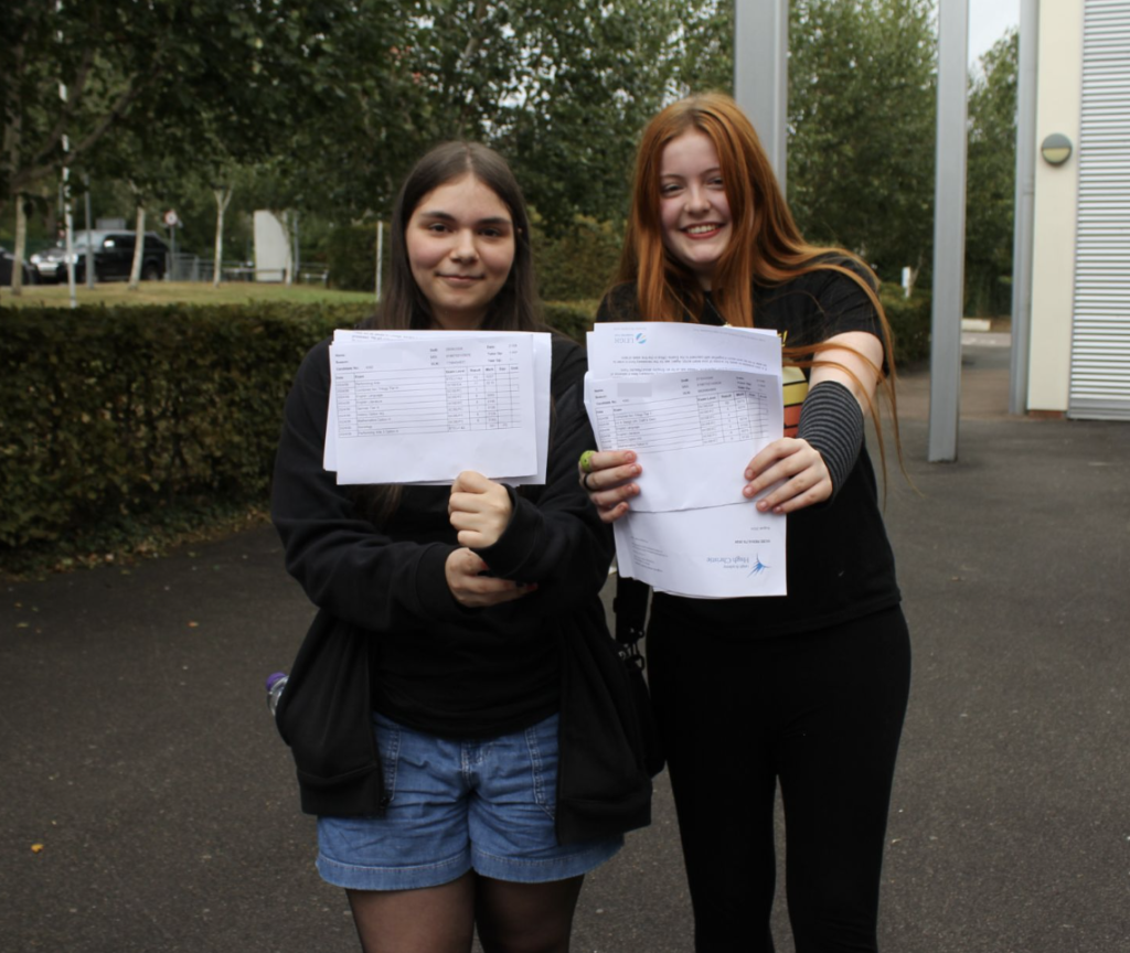 Students stood holding their results