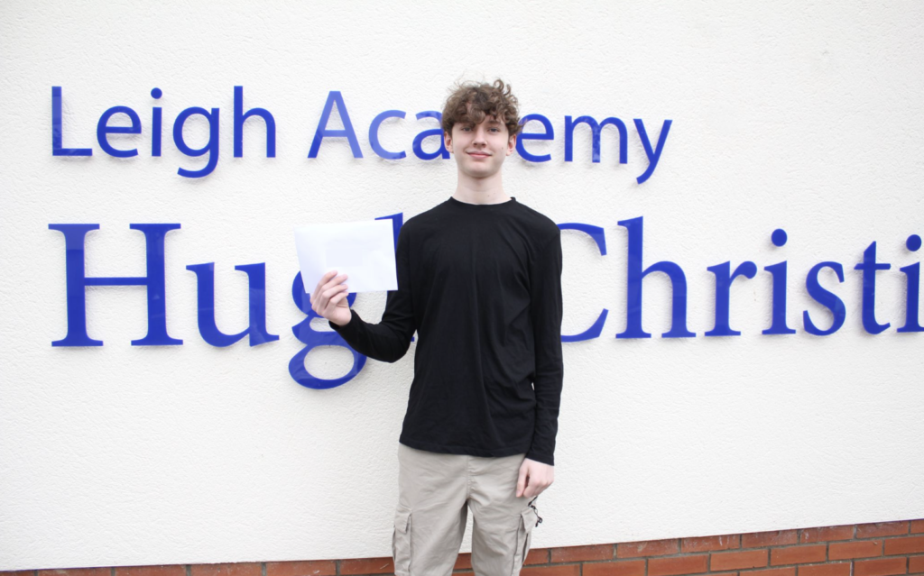 Students stood holding their results